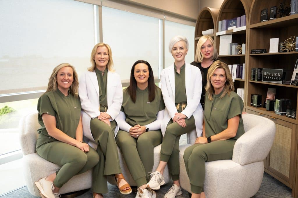 Portrait of the whole team at Alkemē Aesthetics & Dermatology in Moline, IL.